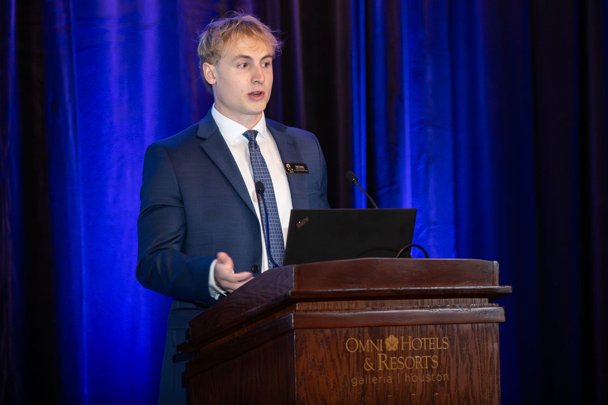 Kyle Coutray speaking at a podium