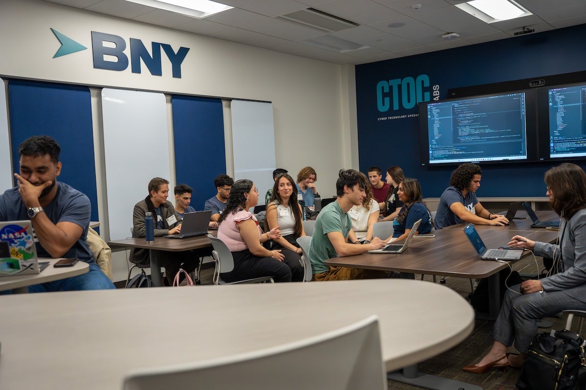 Students working at laptops