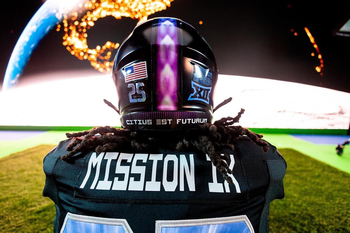 Football player seen from behind wearing a helmet and jersey with “MISSION IX” text, standing before an Earth-from-space backdrop.