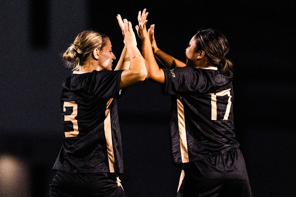 UCF's #3 Guta Franke and #17 Honoka Hamano high five