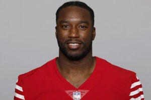 Richie Grant in red football jersey