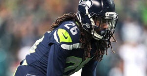 Shaquill Griffin in his Seattle Seahawks uniform in defensive stance 