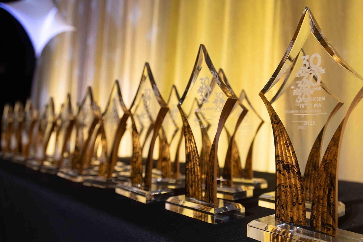 closeup of glass diamond-shaped awards on table