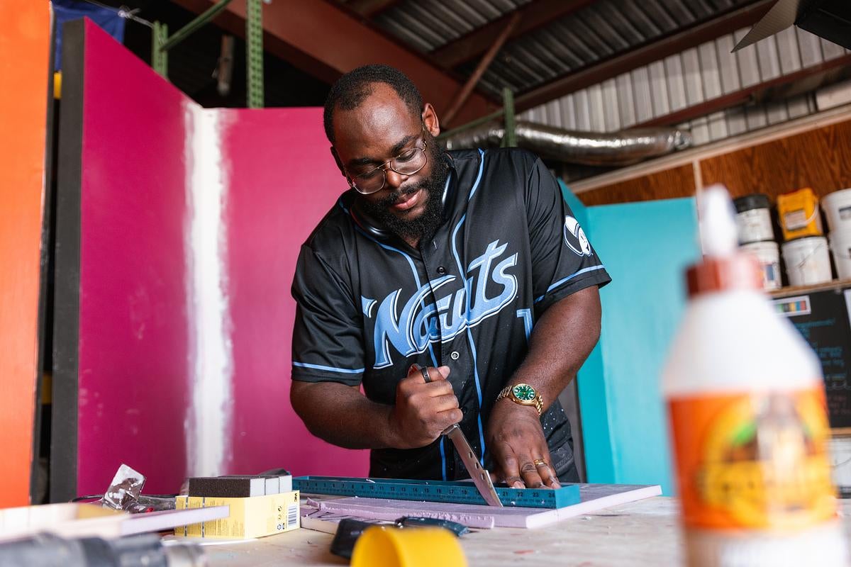 A man working on an art piece