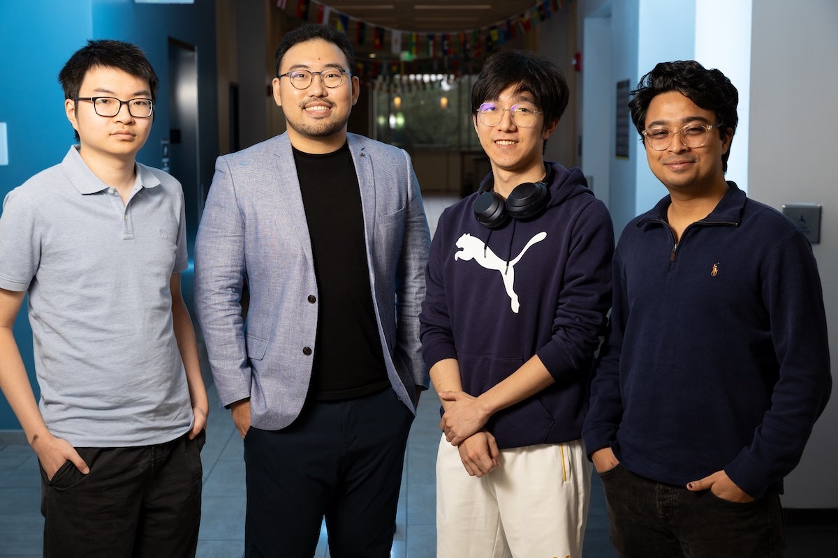 Four people posing for a photo