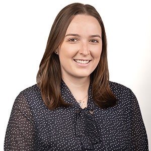 Portrait of brunette woman in dark gray blouse