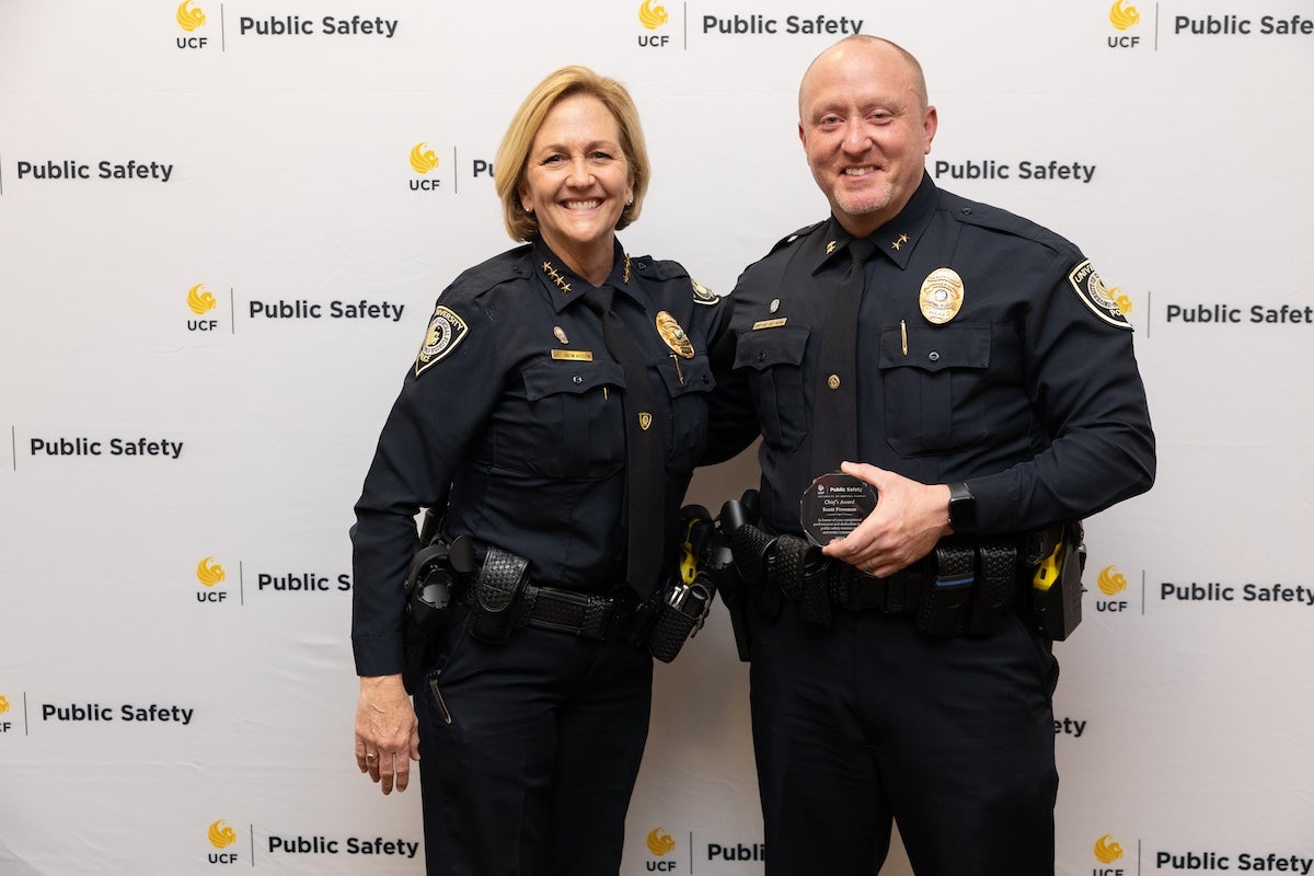 Two police officers posing for a photo