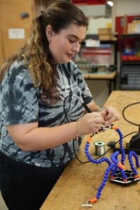 A student working with technical equipment