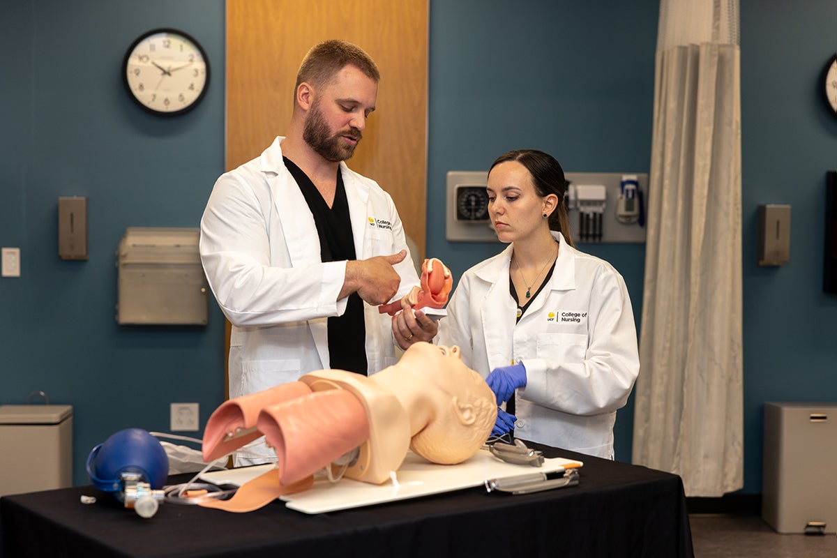 Acute Care Nurse Practitioner DNP students demonstrate skills in the health assessment lab during the opening tour of the Dr. Phillips Nursing Pavilion in Lake Nona.