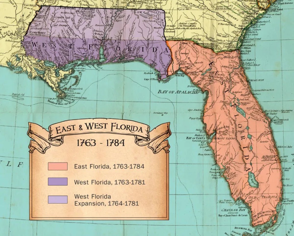 A historical map of the state of Florida, splitting it into two colored sections - purple for west Florida and red for East Florida