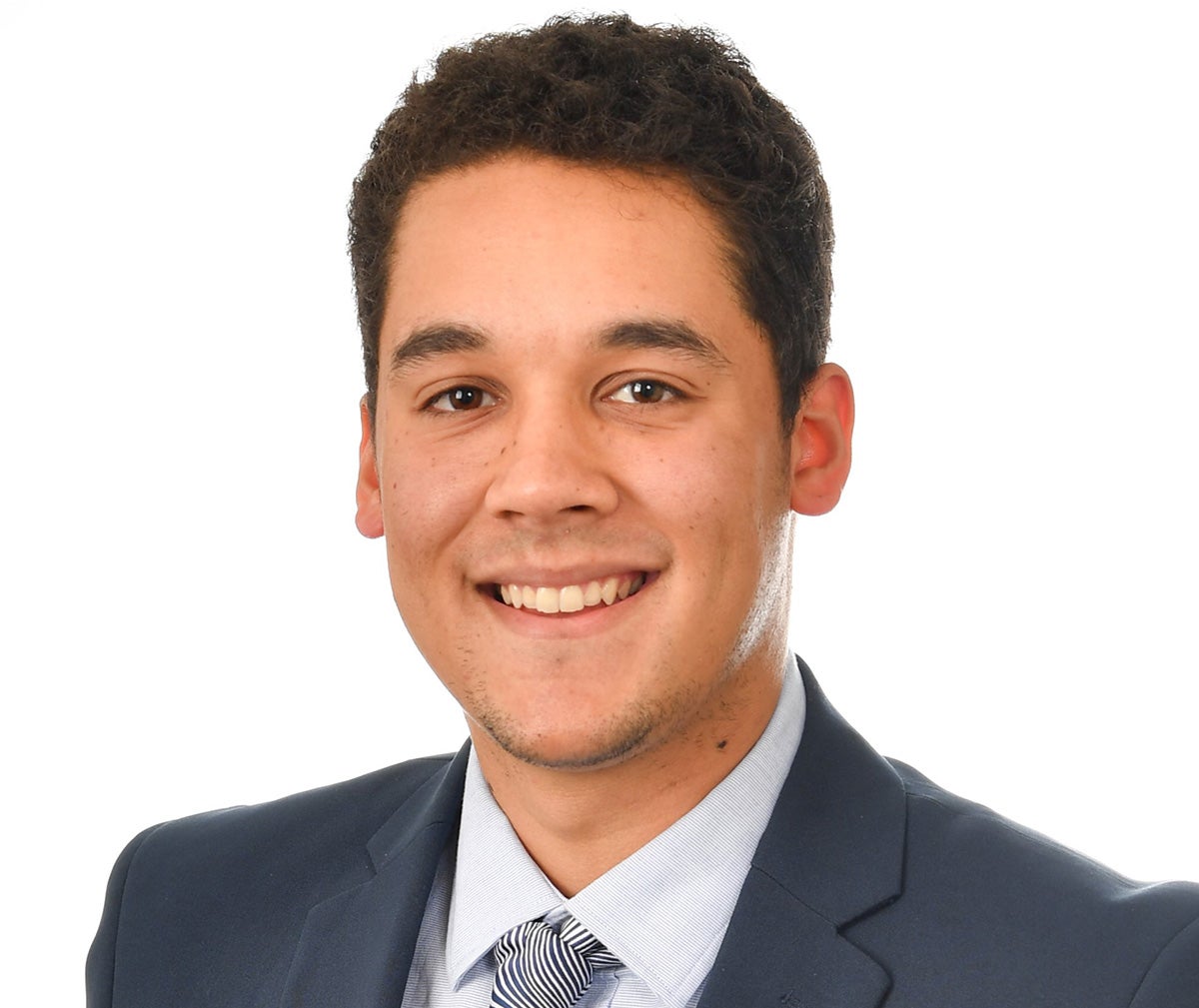 Portrait of smiling man with short dark hair in gray business suit and tie