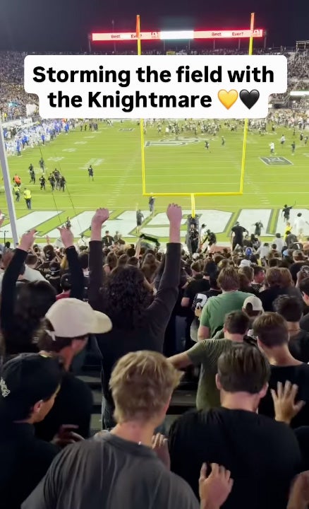 Image from back row of student section at Acrisure Bounce House with text that reads Storming the field with the Knightmare and black and yellow hearts