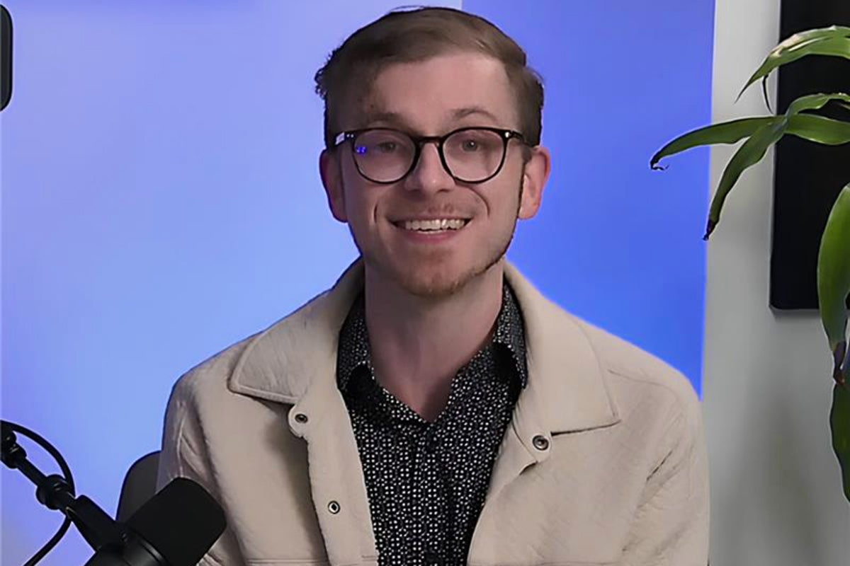 Alex Bair in front of a mic