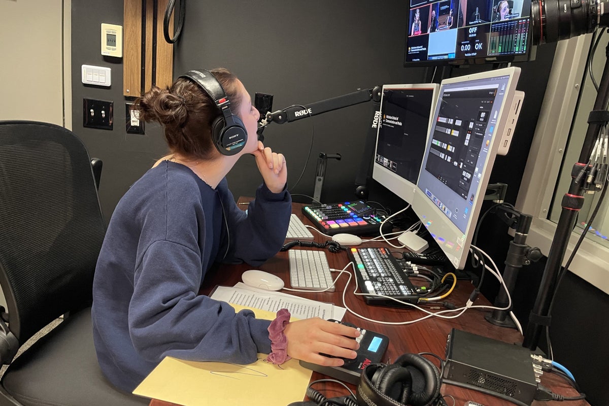 A person using podcast software on a computer