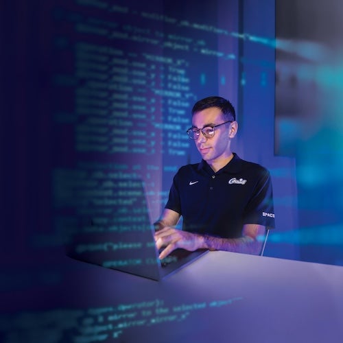 Course design materials and code on a desk