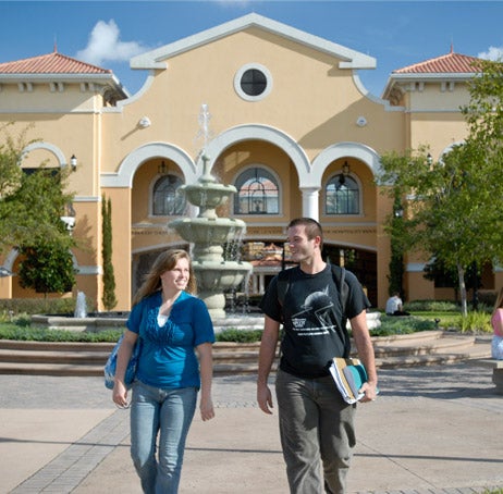 Students walking in front of the Rosen College of Hospitality Management