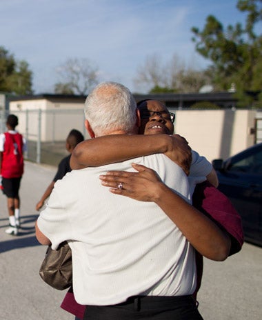 Harris Rosen receiving a hug from a community member