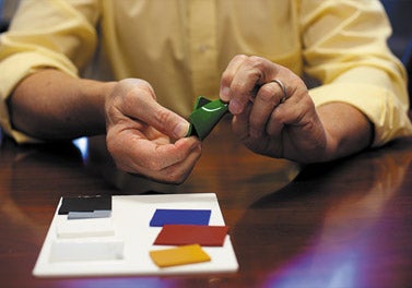 Photo of Britt Chooser's hands with color chips.