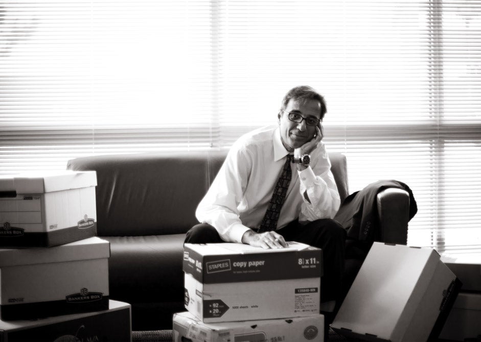 Dr. Michael Georgiopoulos readies his office for his first day as interim dean at the College of Engineering and Computer Science.