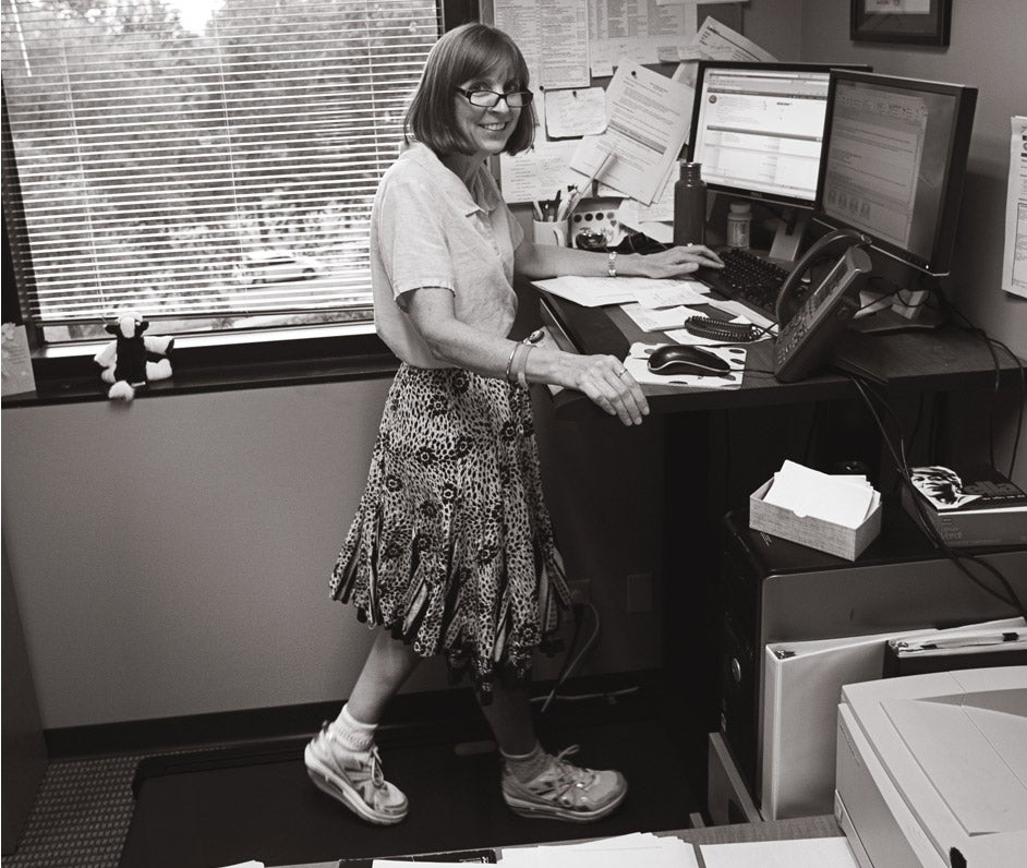 Dr. Anne Norris walks up to 12 miles a day at her treadmill desk, a gift from her husband.