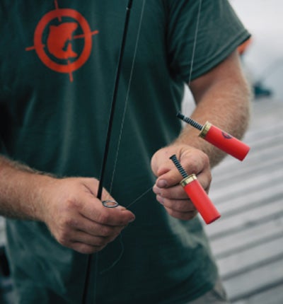 Image of setting fishing ammo onto a fishing line