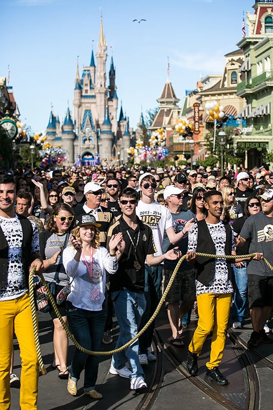 UCF Fans follow the parade at Magic Kingdom