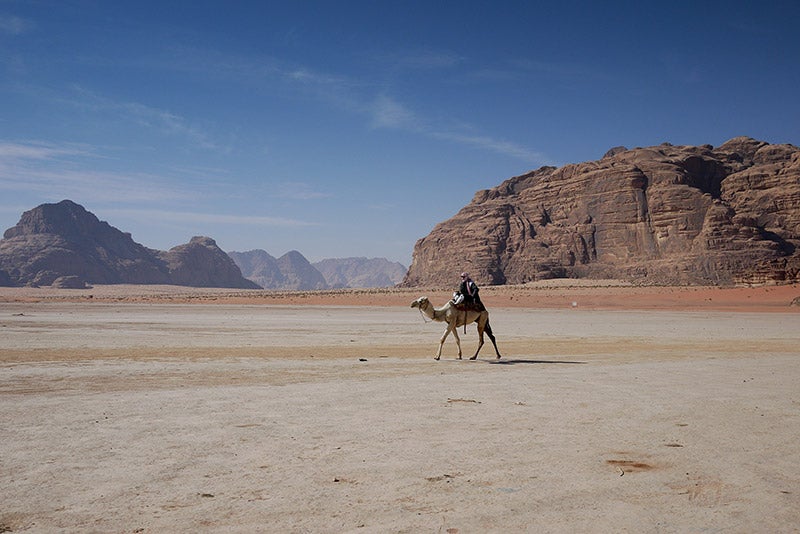 a-bedouin-crosses-wadi-rum-desert-in-Jordan