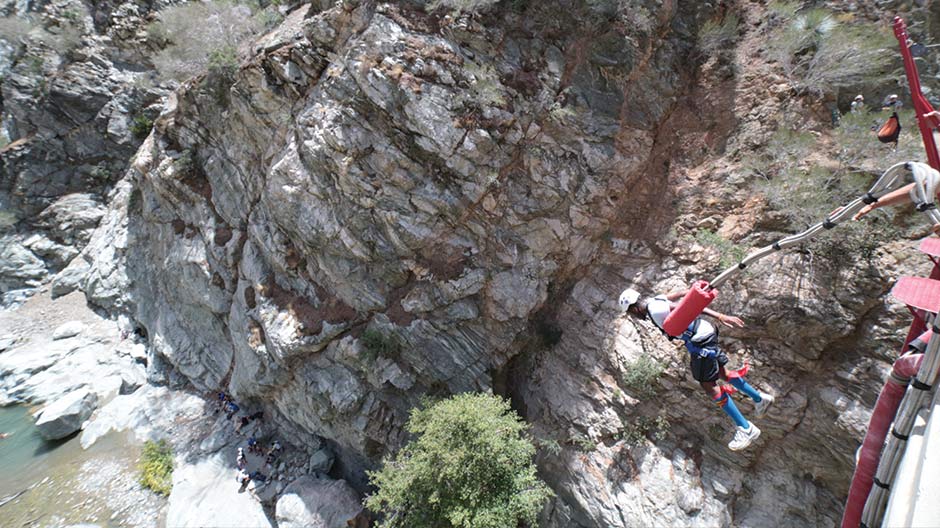 A person bungee jumping on the Bridge to Nowhere, San Gabriel Mountains