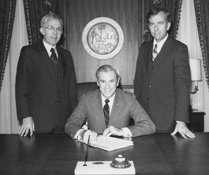 Florida governor Reuben Askew sitting at his desk