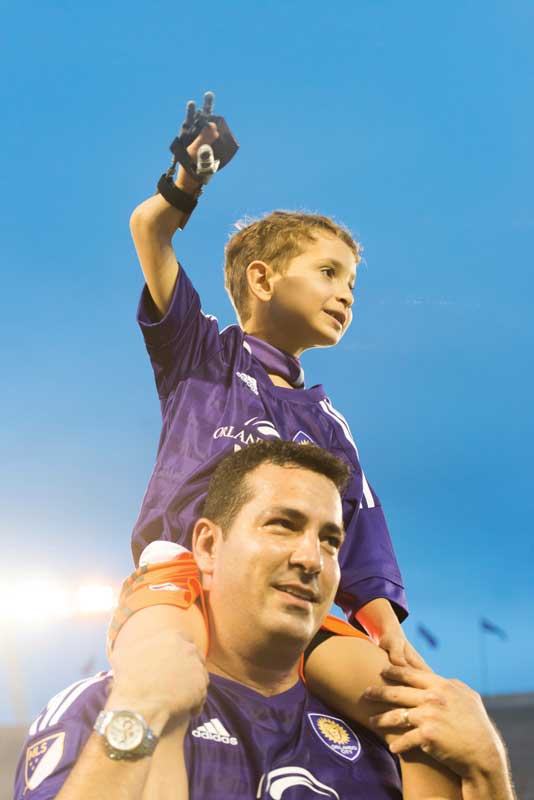 Boy on Dad's shoulders