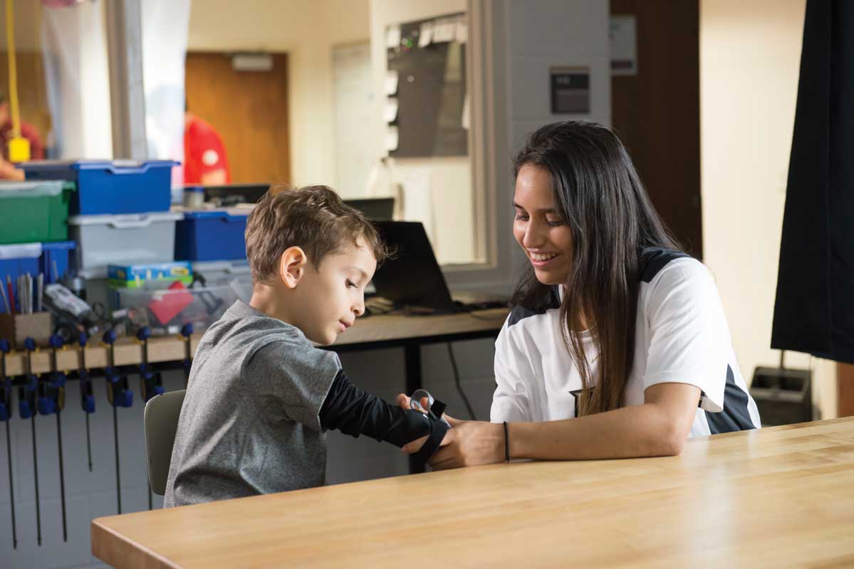 Girl helping put on hand