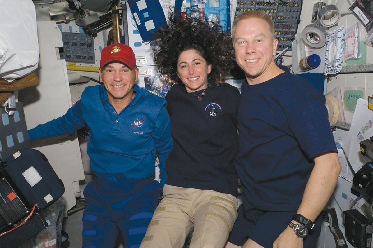 Stott and mission specialist Tim Kopra pose for a photo on Discovery while docked at the ISS