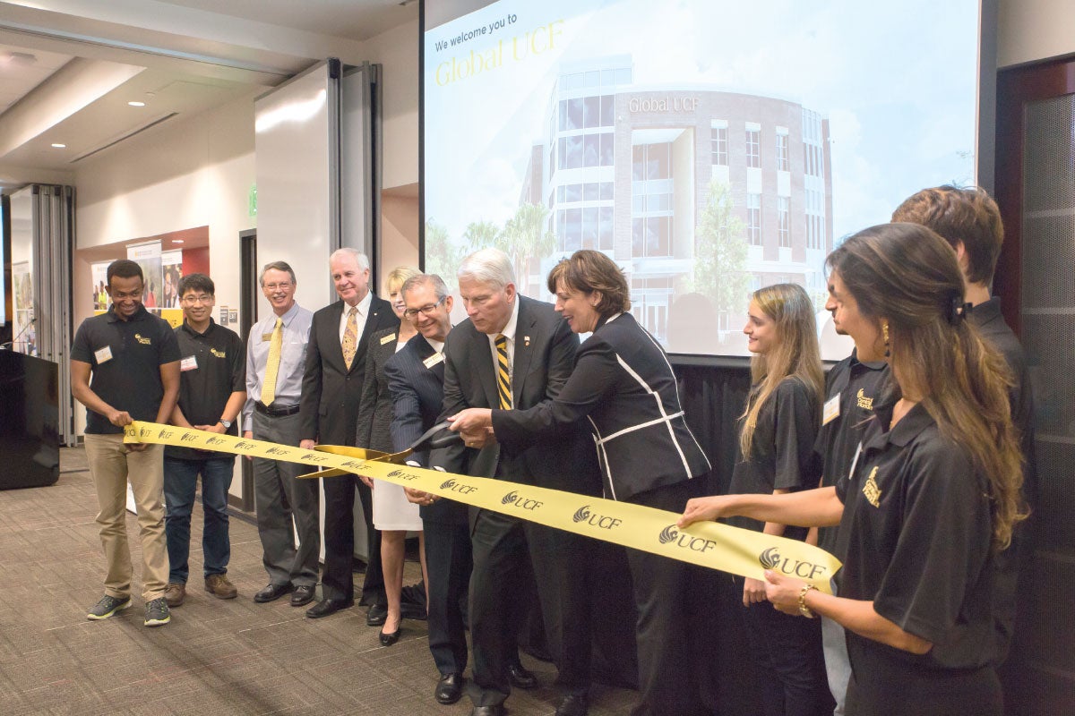 President Hitt cuts ribbon at ribbon cutting ceremony