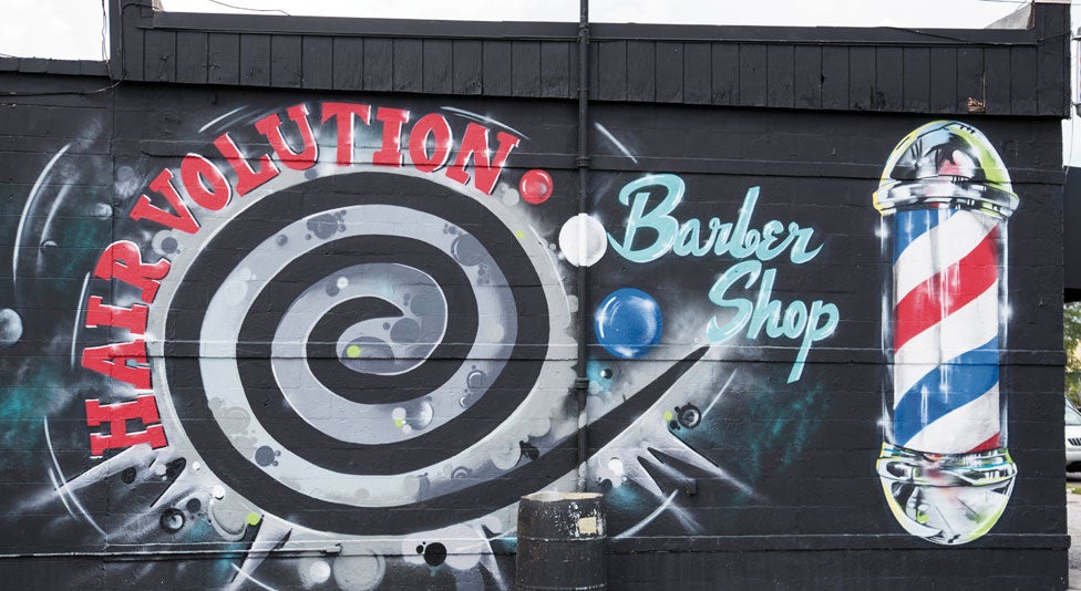 Mural on side of a barber shop