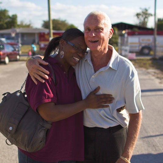 Harris Rosen and woman hugging