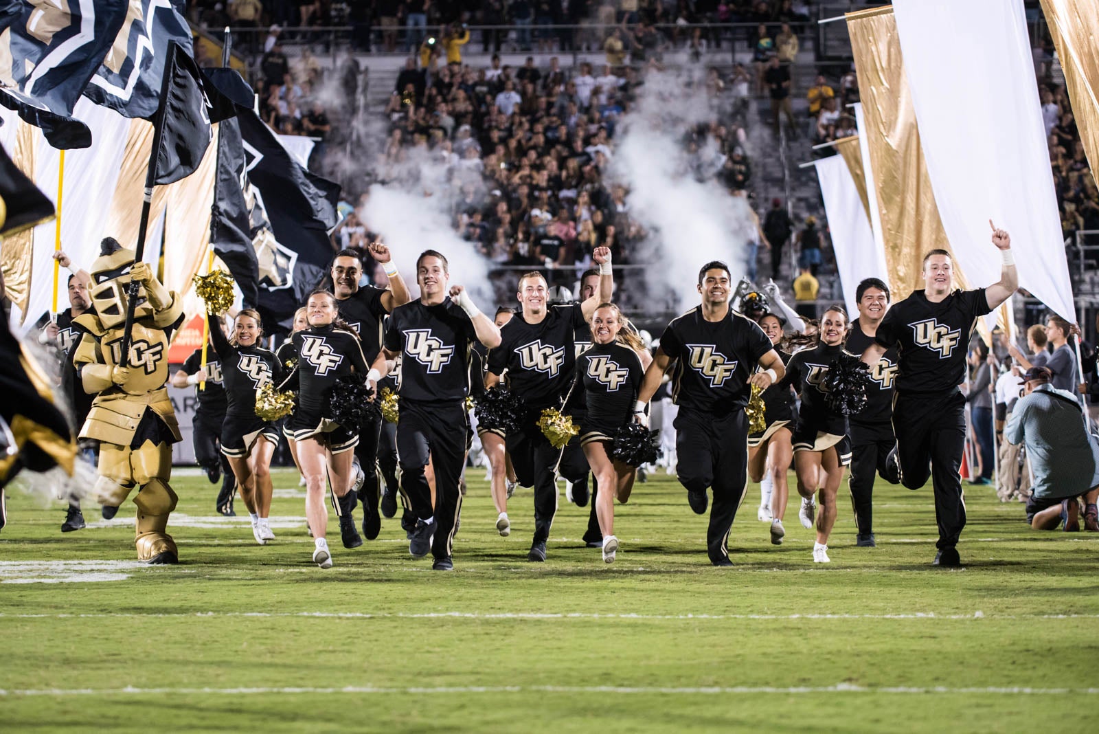 ucf-best-of-photos-cheerleaders-charge-the-field