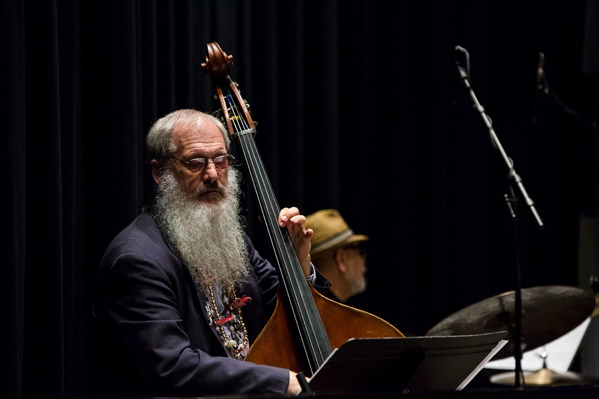 UCF Instructor Richard Drexler plays an upright bass on stage.