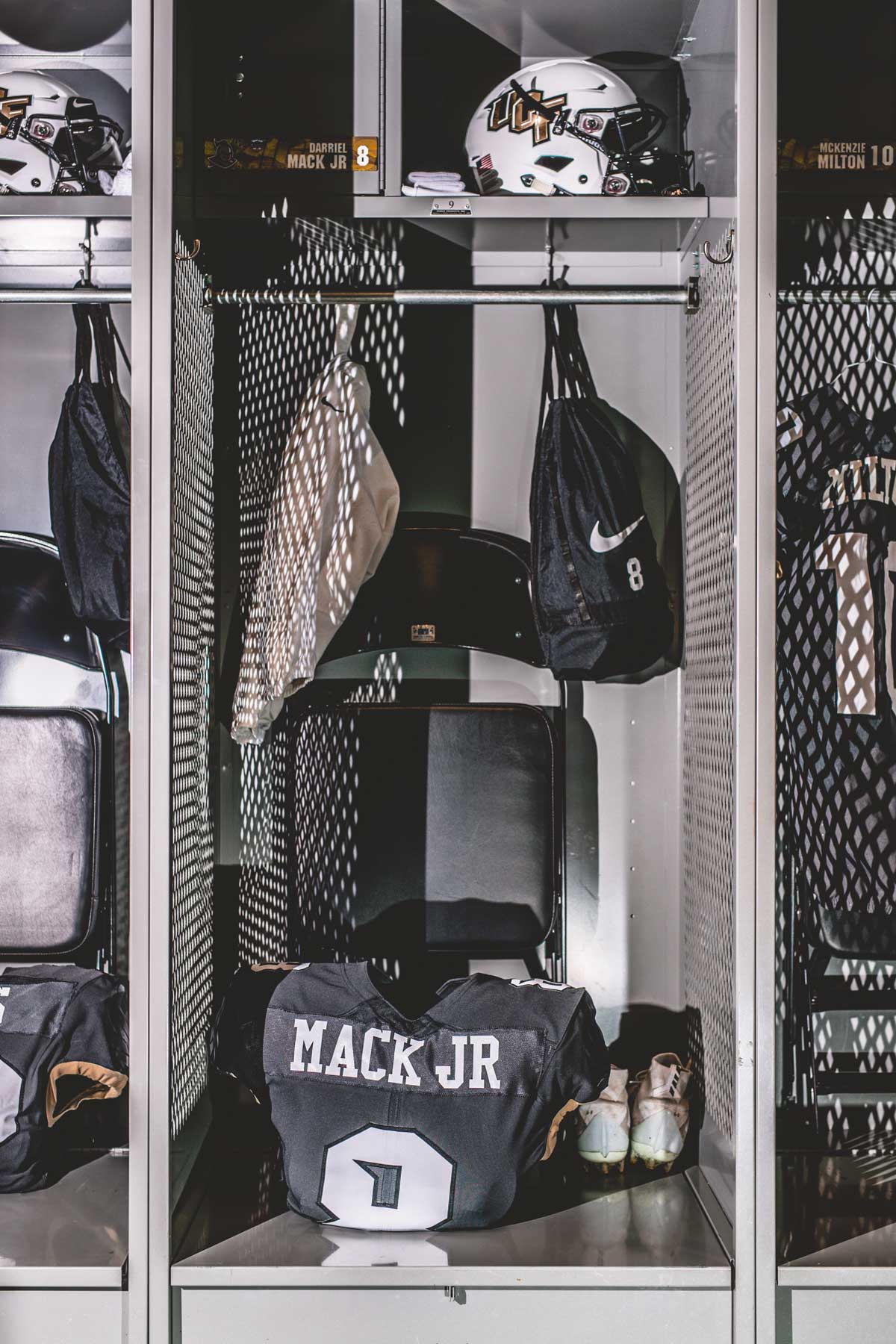 single locker with a black jersey and a Nike bag hanging