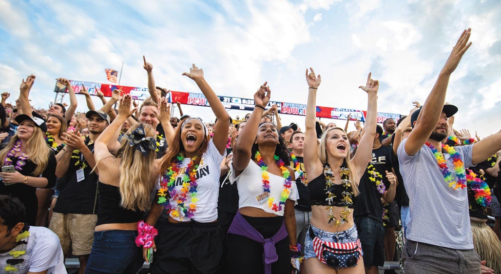 ucf fans in the student section at a football game