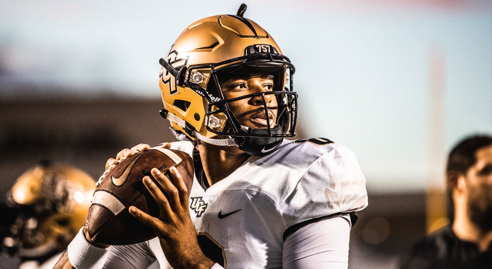 ucf quarterback Darriel Mack Jr. looks to throw the football during the game against east carolina