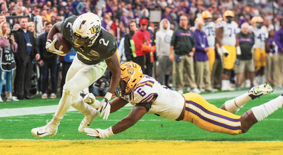 ucf running back Otis Anderson scores a touchdown against lsu ucf running back Otis Anderson scores a touchdown against lsu