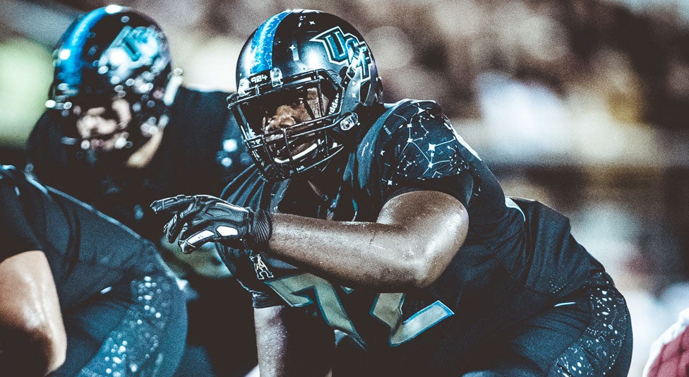 ucf offensive lineman jordan johnson at the line of scrimmage during game against temple