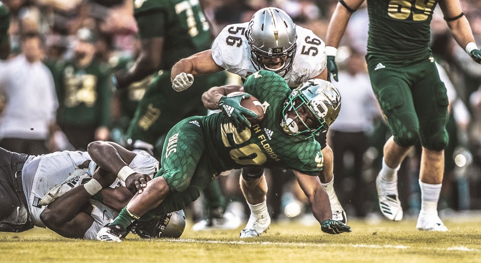 ucf offensive linebacker pat jasinski tackles usf player with football