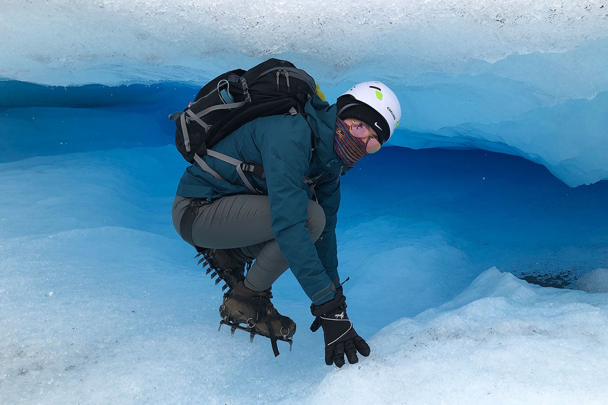 A man standing on a glacier.