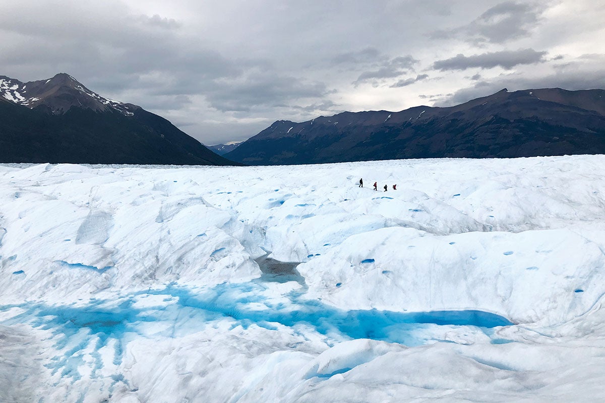 A giant glacier with a mountain in the background.