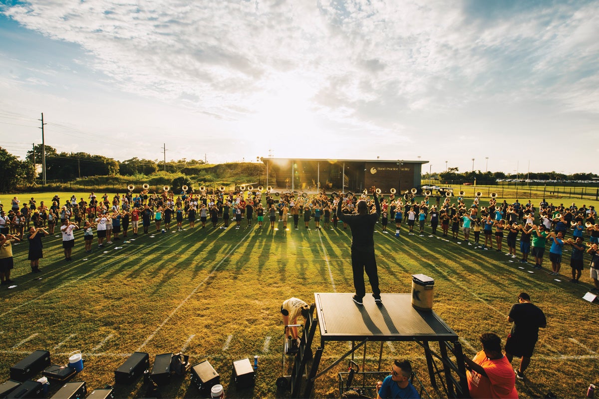 Tremon Kizer directs the Marching Knights on Driggers Field.