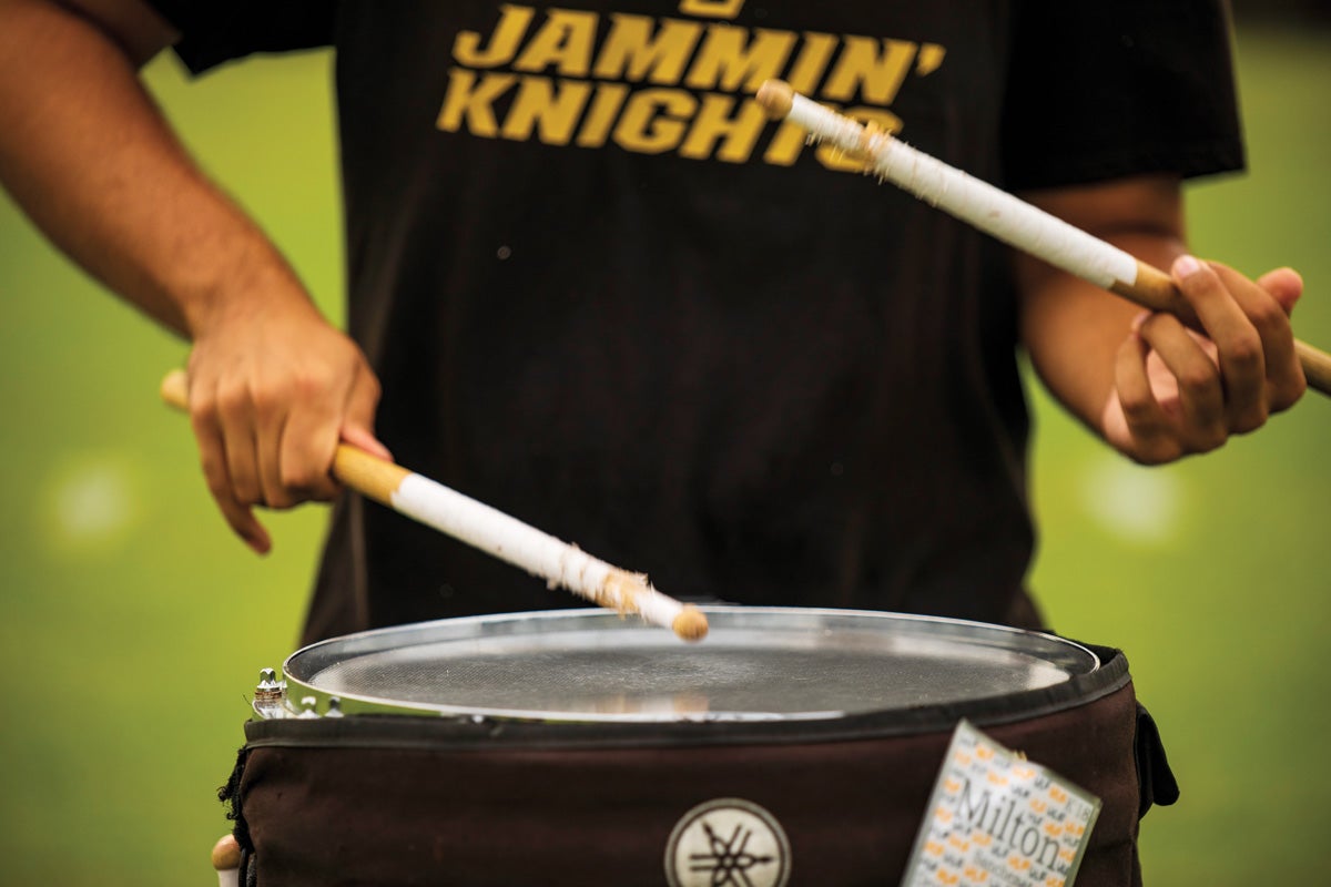 A person playing the drums.