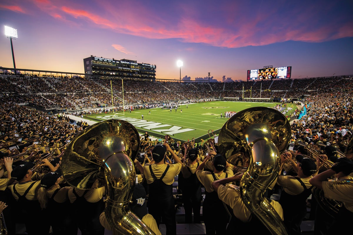 The Marching Knights play inside Spectrum Stadium.