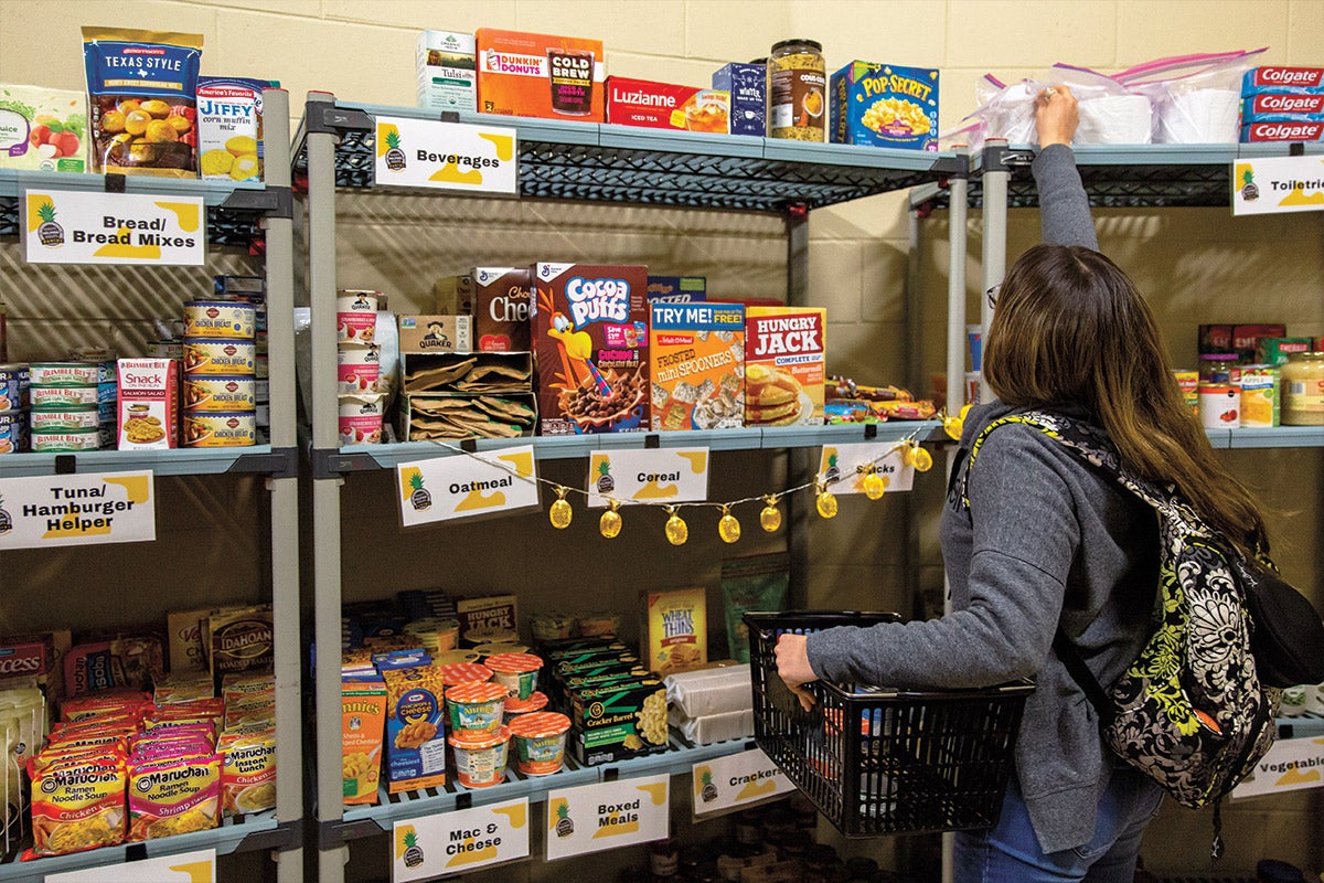 Woman browses shelves of food