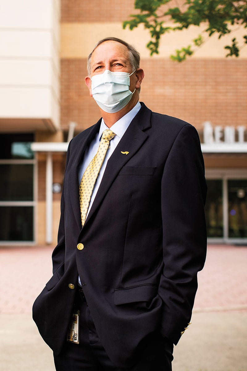 Michael Deichen wears a mask outside of UCF' Student Health Center.